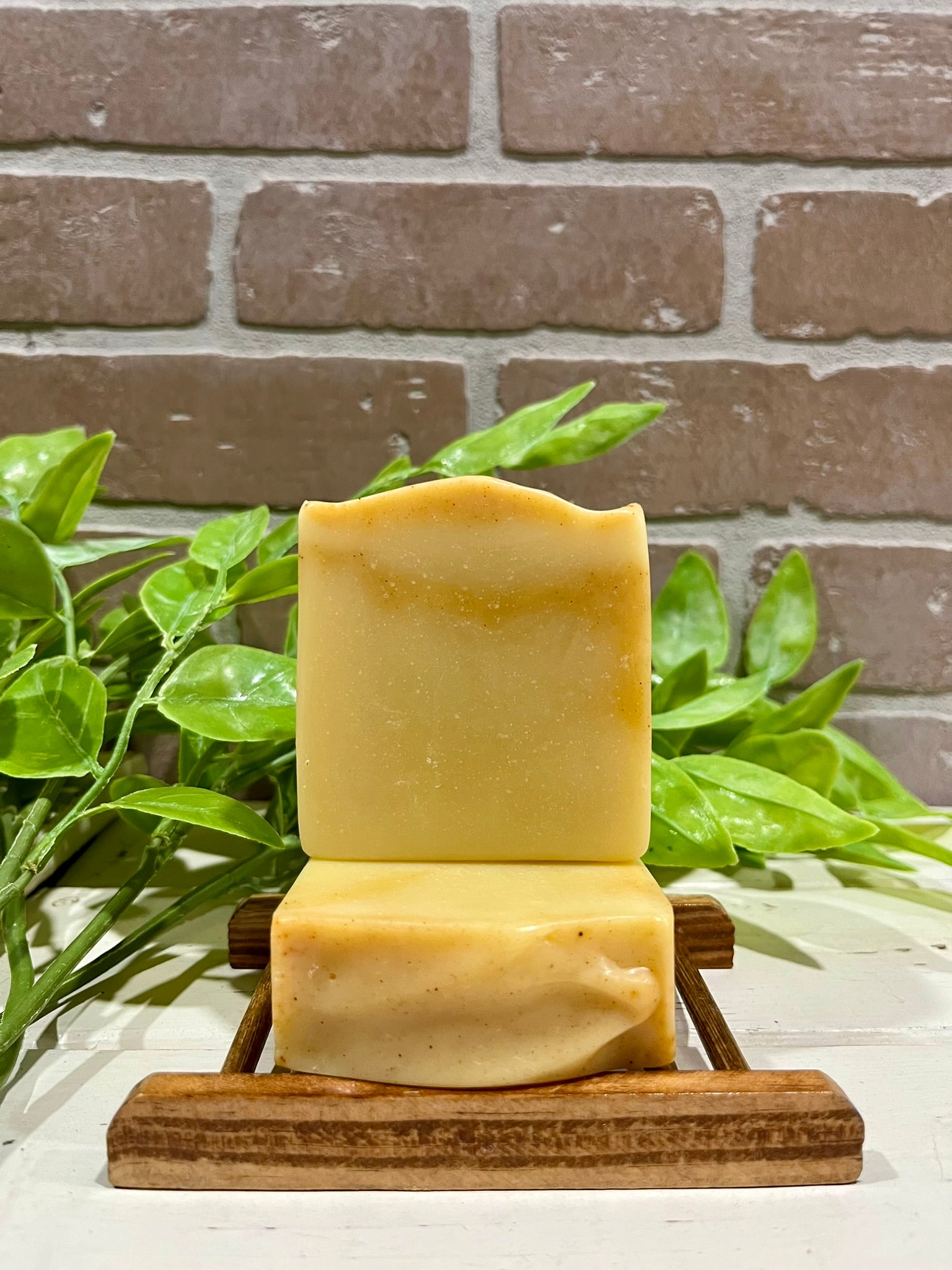 Lemon soap bars in front of brick wall